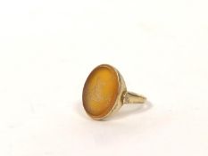 Signet ring with oval carnelian intaglio, crested, probably 18ct gold. size 'S½' Gross 6.2g.