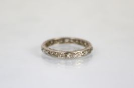 A diamond set full eternity ring, the white white metal ring set throughout with brilliant cut