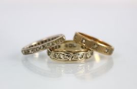 A colourless stone set full eternity ring, all set in yellow and white metal stamped '9ct', ring