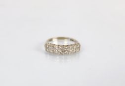 A two row diamond eternity ring in 18ct white gold, 'T LD' London 1975, designed as two rows of
