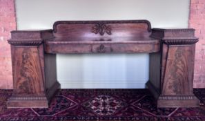 A large William IV mahogany pedestal sideboard of country house proportions, the gallery back with