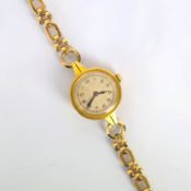 An early 20th century ladies 18ct gold IWC wristwatch, the silver coloured circular dial with Arabic