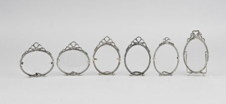 Lot of silver photo frames, bows