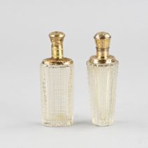 2 perfume bottles with gold