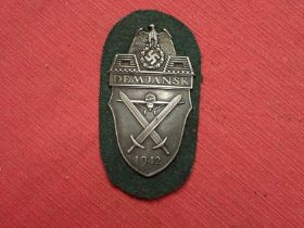 WW2 German Army Demjansk Shield Demjansk on army feldgrau woollen backing. Good clean condition.