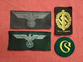 Four WW2 German cloth insignia Two uncut Bevo breast eagles and an uncut SA Bevo sports badge. And a