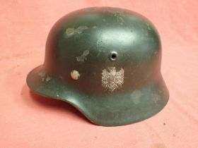WW2 German Army M.40 steel helmet Dark green single-decal army helmet. Random chips overall to the