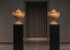 Large urn-shaped vases in Giallo Antico marble