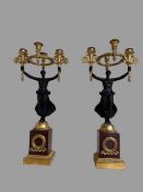 Pair of gilded and patinated bronze candlesticks