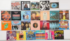 A varied collection of vinyl records featuring jazz-fusion, country, and soul, alongside a wide s...