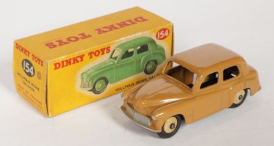 Dinky Toys 154 Hillman Minx Saloon - Tan body with silver trim and light beige ridged hubs,