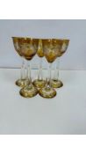Five Bohemian Amber Flashed and Vine Cut Wine Glasses