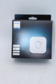 Two Philips Hue Lighting Items to include 1x Bridge, 1x 3 Pack A60 – B22 Smart Bulbs, 806 Lumen