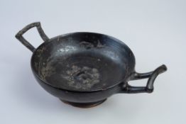 Black-Glazed Kylix with Stamped Female Head Medallion, South Italy, 4th Century BC