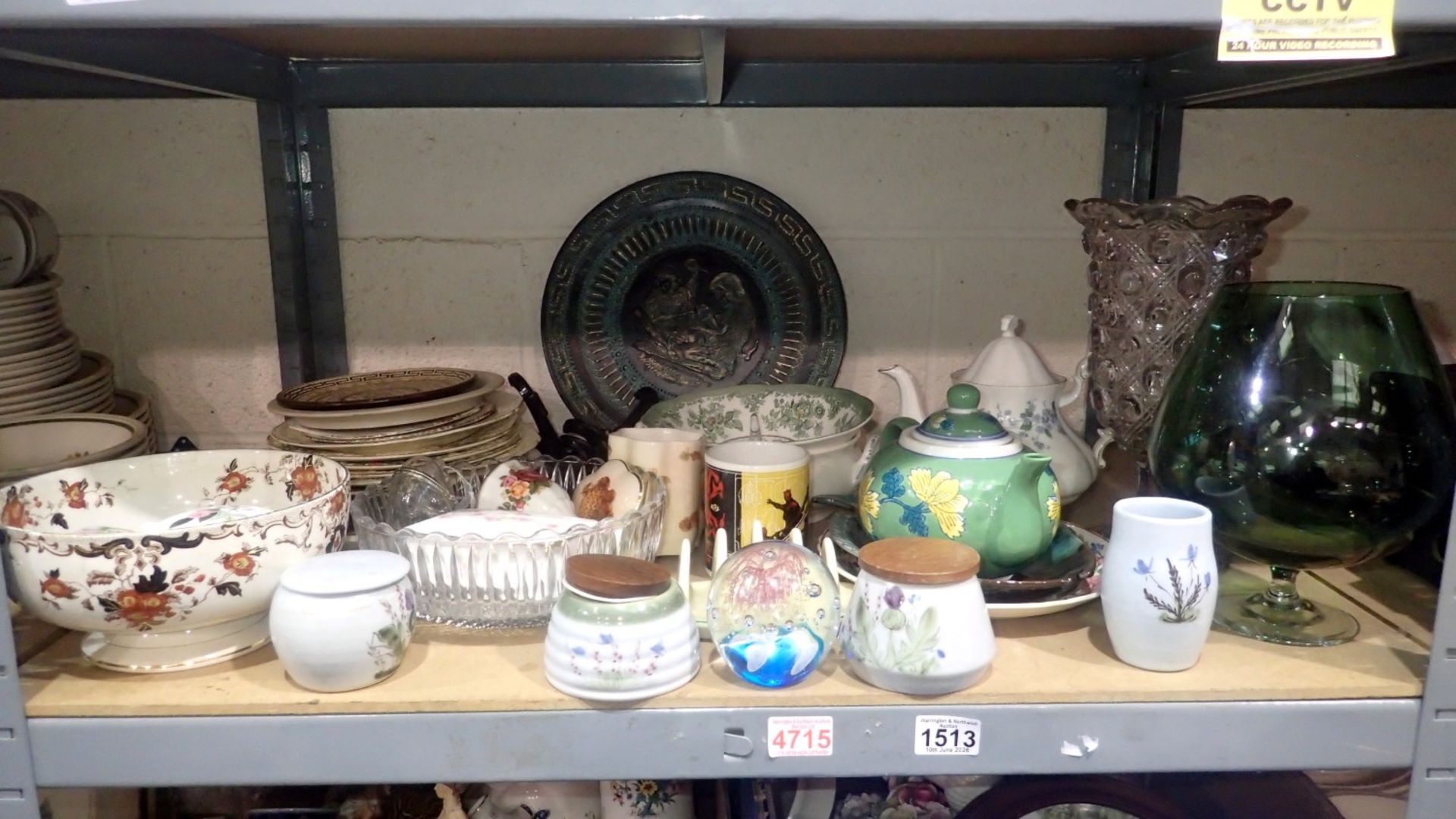 Shelf of mixed ceramics and glassware including tea pots and Wedgwood. Not available for in-house