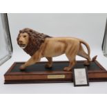 Large Franklin Mint porcelain lion sculpture 'Monarch Of The Serengeti' mounted on a wooden