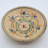 18th century Spanish centre bowl, interior painted with the letter L, painted borders and banding to