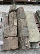 Ten red brick coping and a concrete block