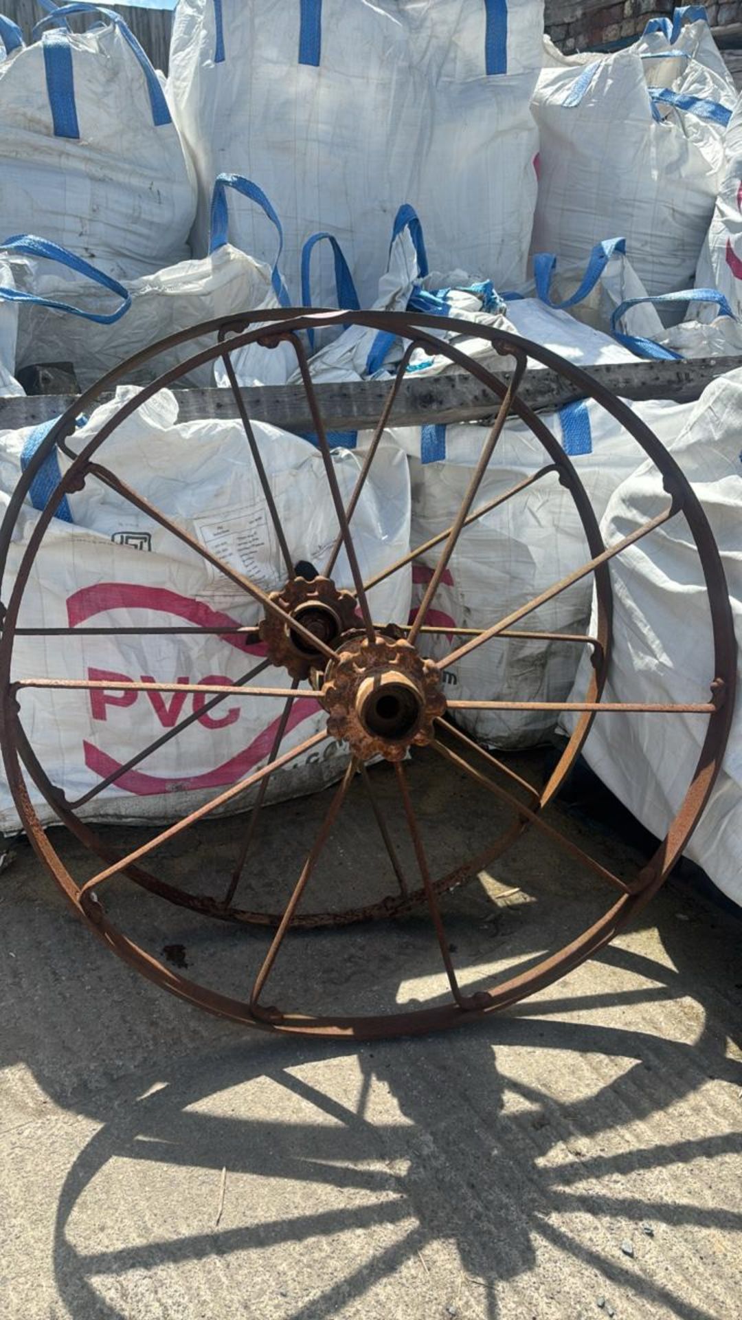 Pair of Bamfords Uttoxeter cast iron wheels, 124cm diameter