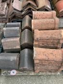 Approx. 70 angled ridge roof tiles
