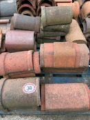 Approx. 35 assorted half round and angled ridge roof tiles