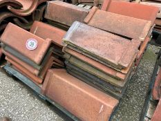 Approx. 35 mixed angled ridge roof tiles