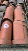 Approx. 20 half round red ridge roof tiles