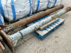 A pair of heavy cast iron pillars, 287cm h
