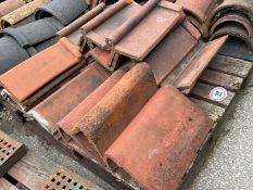 Approx. 20 assorted angled red ridge roof tiles