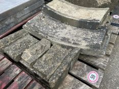 Assorted reclaimed stone coping sections inc. pieces with Tudor rose motif and curved pieces,