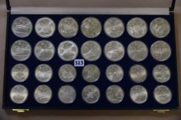 Silber Olympiamünzen Montreal 1976: 14x 10 Dollar und 14x 5 Dollar insgesamt 925/ 1020,6 g