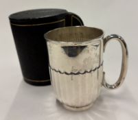 An Edwardian silver christening mug.