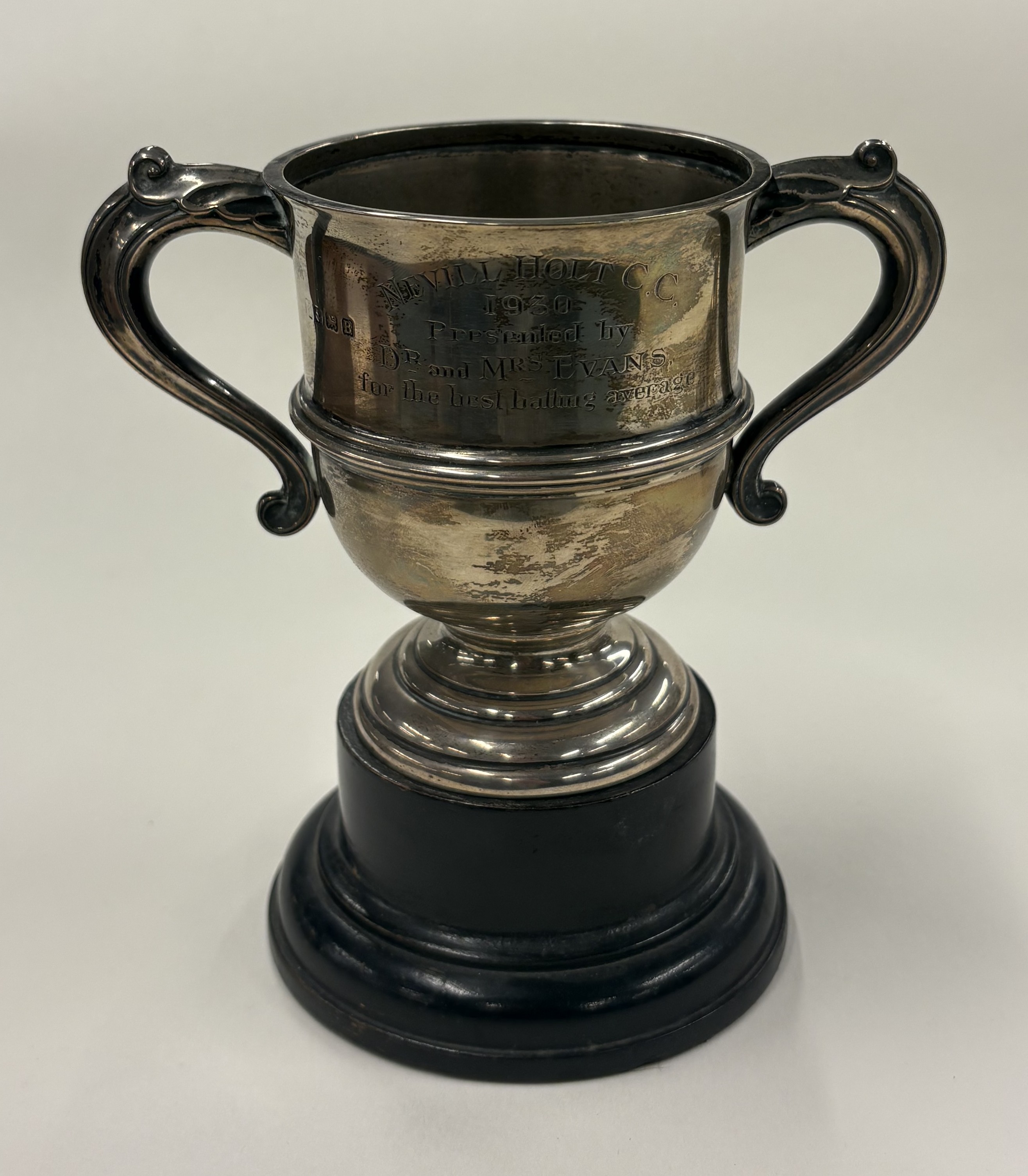 A two-handled silver trophy cup.