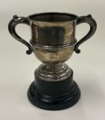 A two-handled silver trophy cup.