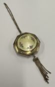 A silver and enamelled compact.