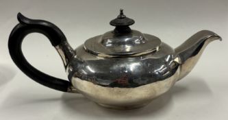 A George III silver bachelor's teapot.
