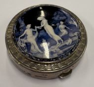 A silver and enamelled compact.