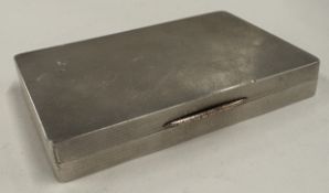 An engine-turned silver snuff box.