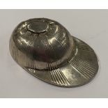 A silver caddy spoon.