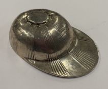 A silver caddy spoon.