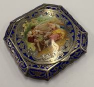 An early 20th Century silver and blue enamelled compact.