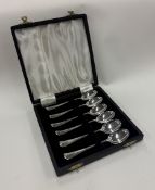 A cased set of six silver rat tail pattern teaspoons.