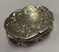 An oval-shaped Victorian silver vinaigrette.