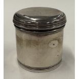 A silver pill box.