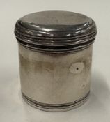 A silver pill box.