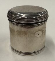A silver pill box.