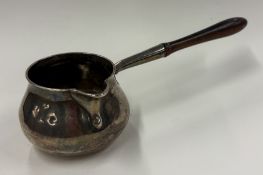 A George III silver brandy pan.