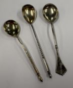 Three Russian silver spoons.