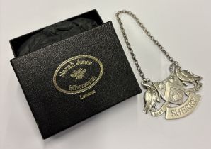 A silver wine label for 'Sherry'.