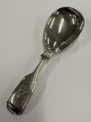 A Victorian silver caddy spoon.